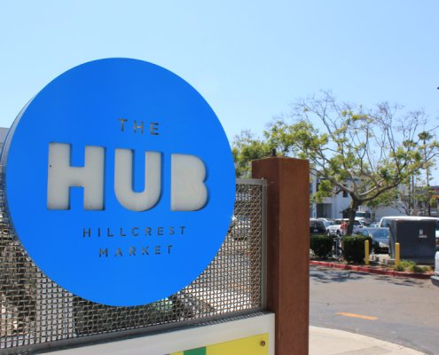 The hub branding on sign
