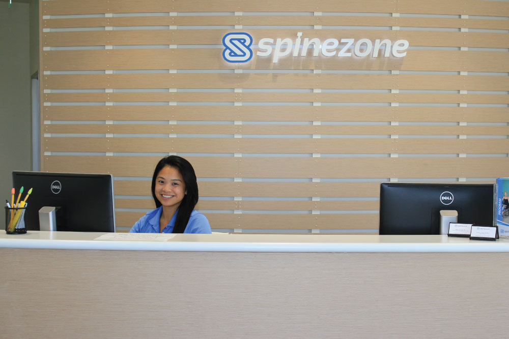 spinezone sign behind reception desk